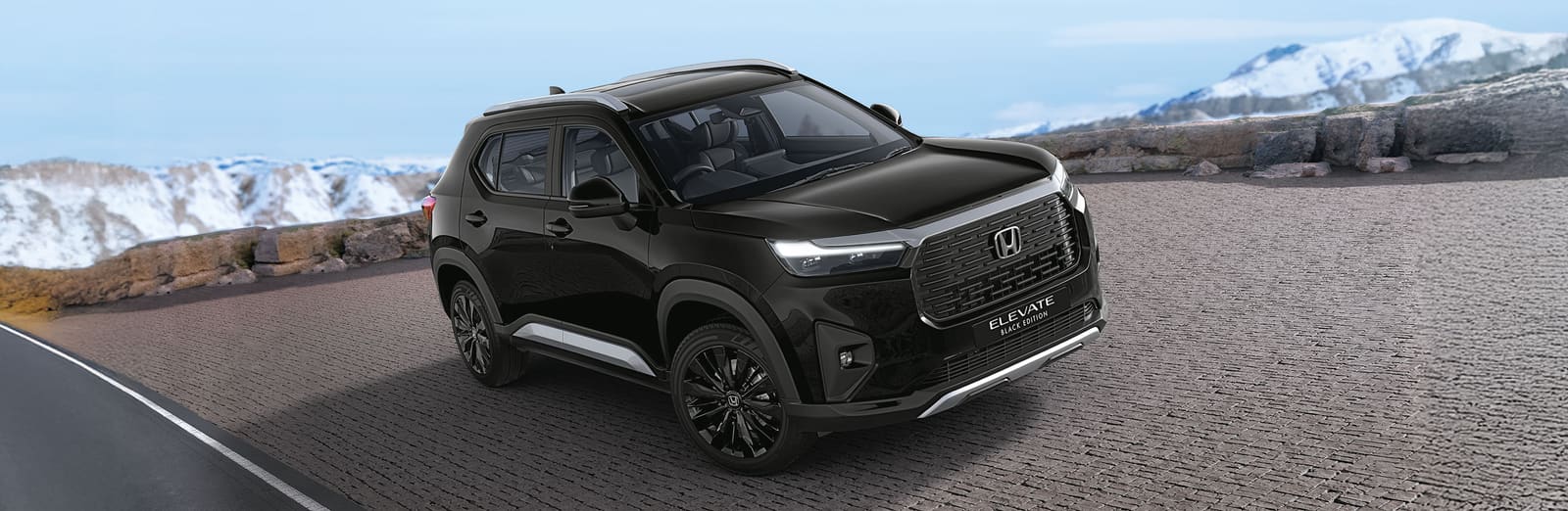 Black Honda Elevate on a mountain road