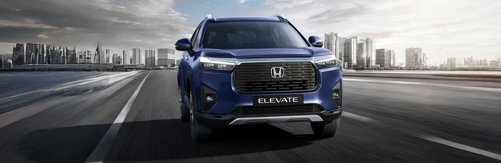 Blue Honda Elevate, front view in the city